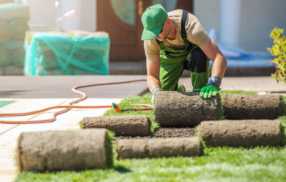 worker doing a sod installation